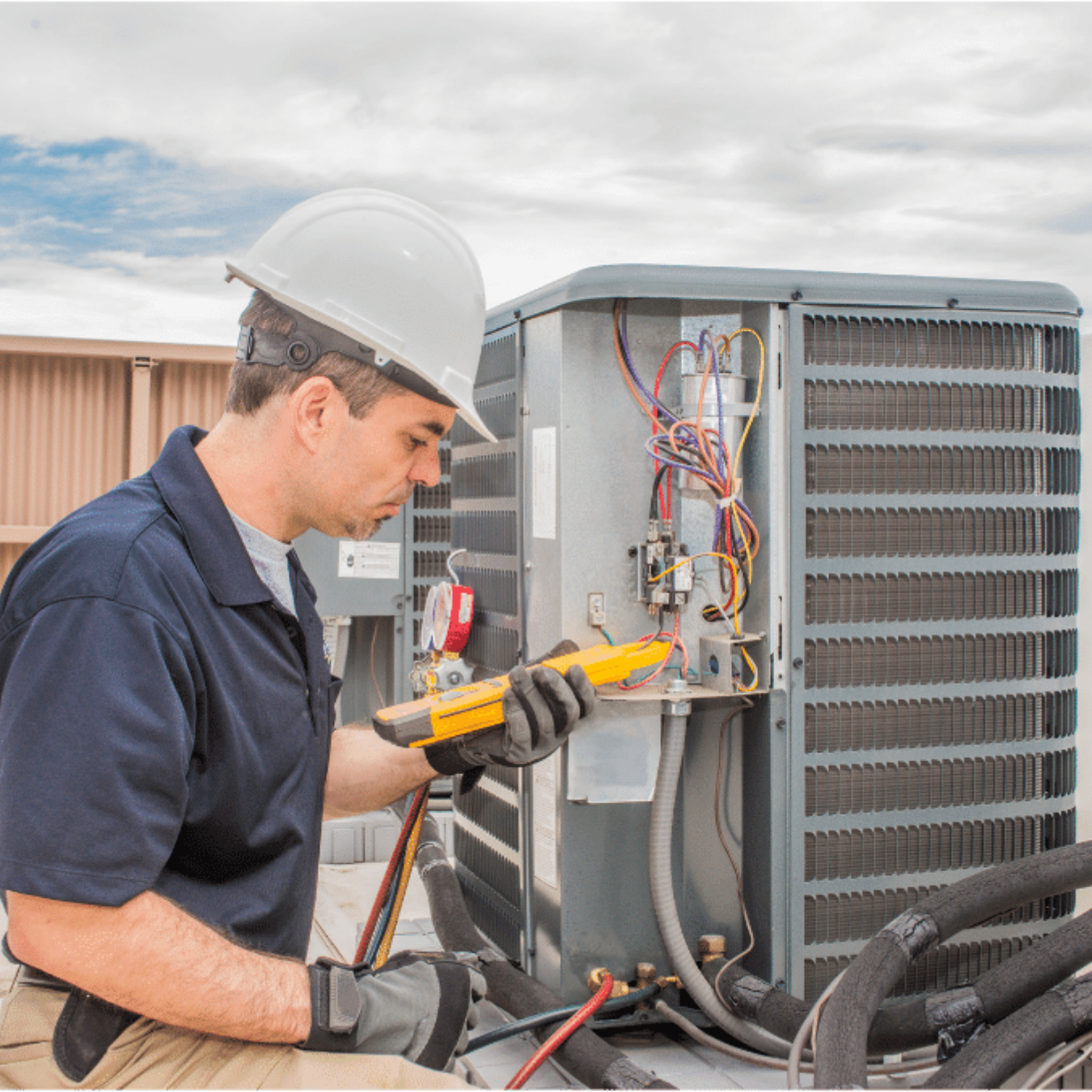 Hamilton HVAC Pros HVAC technician servicing a system