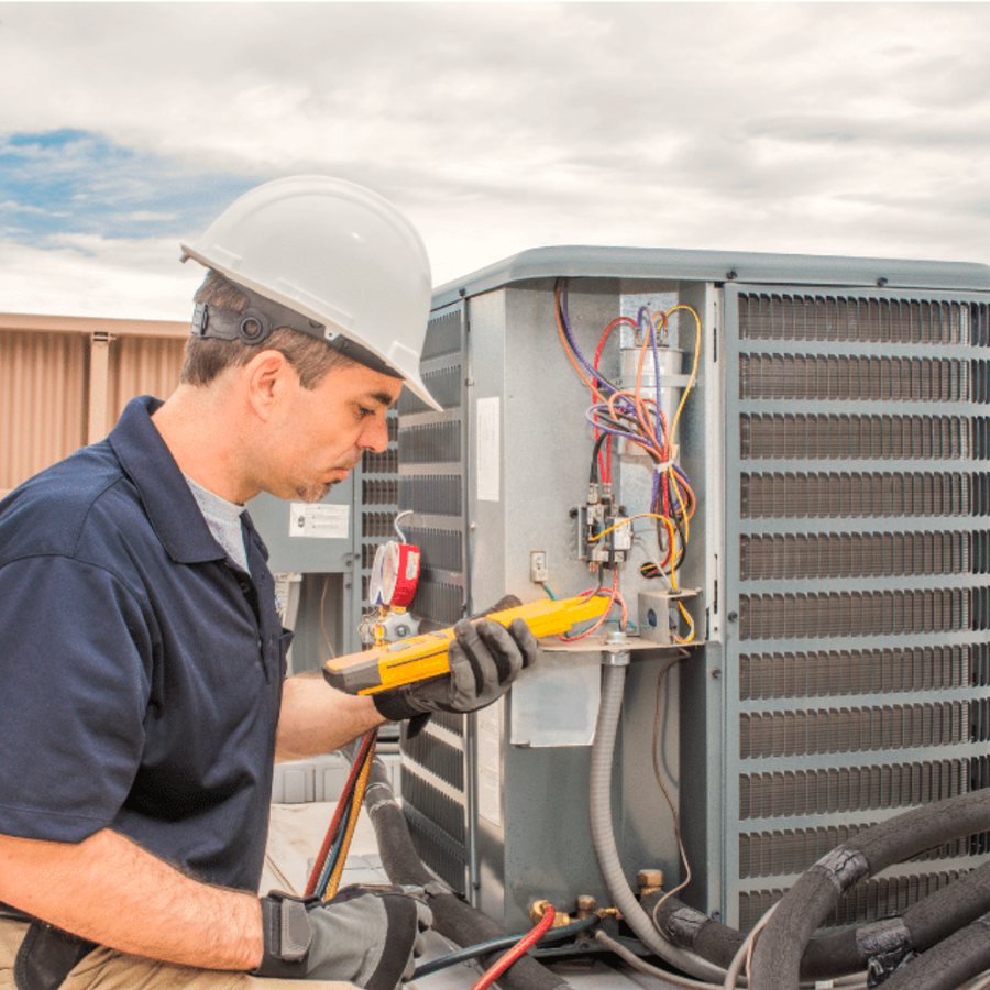 Hamilton HVAC Pros HVAC technician servicing a system